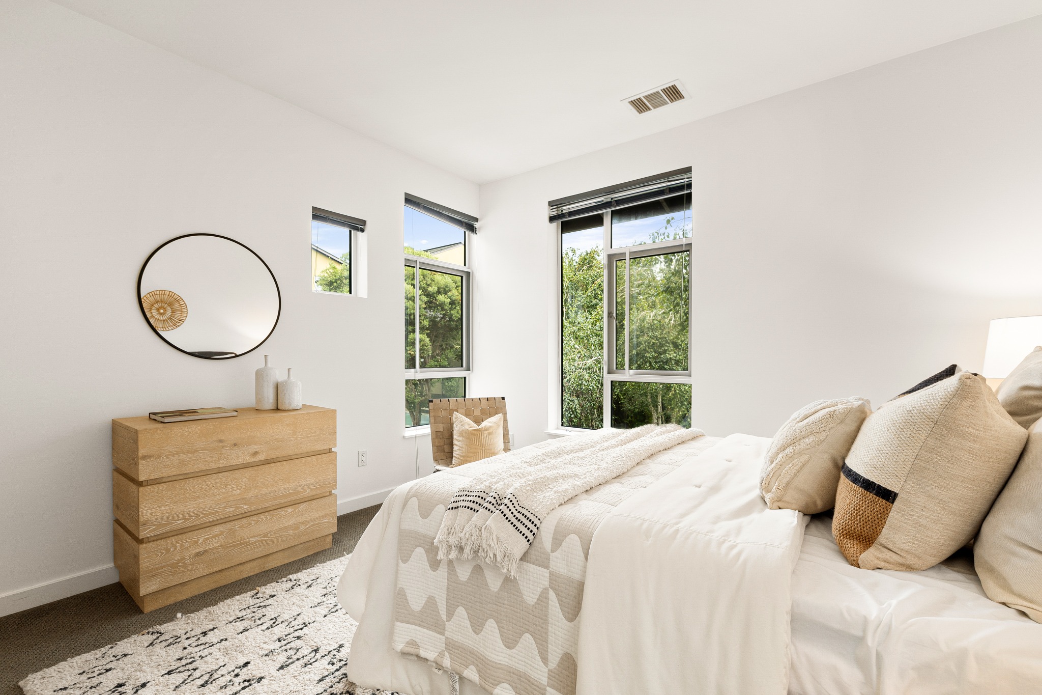 Primary bedroom with treetop views