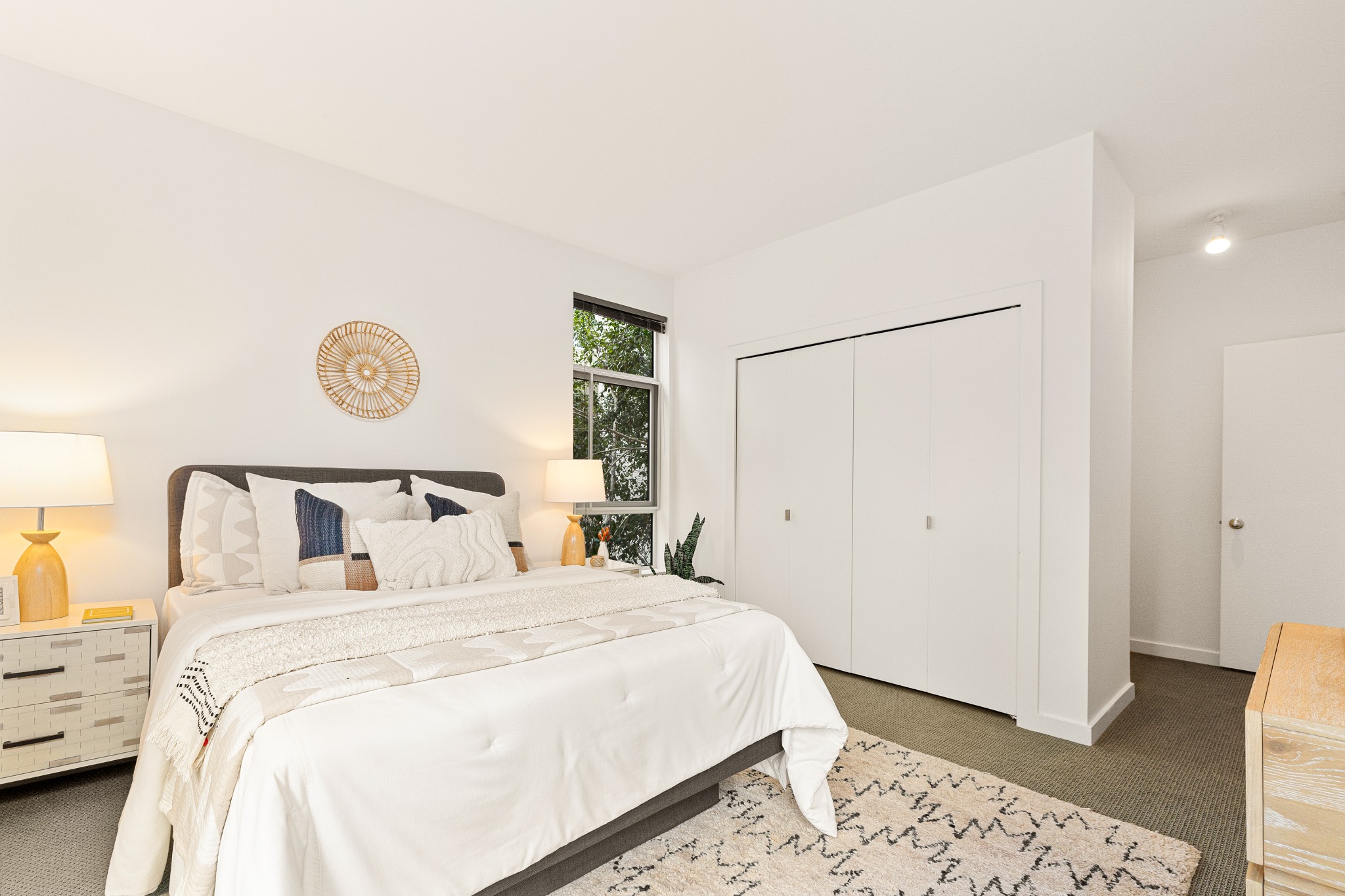 Primary bedroom with closet wall